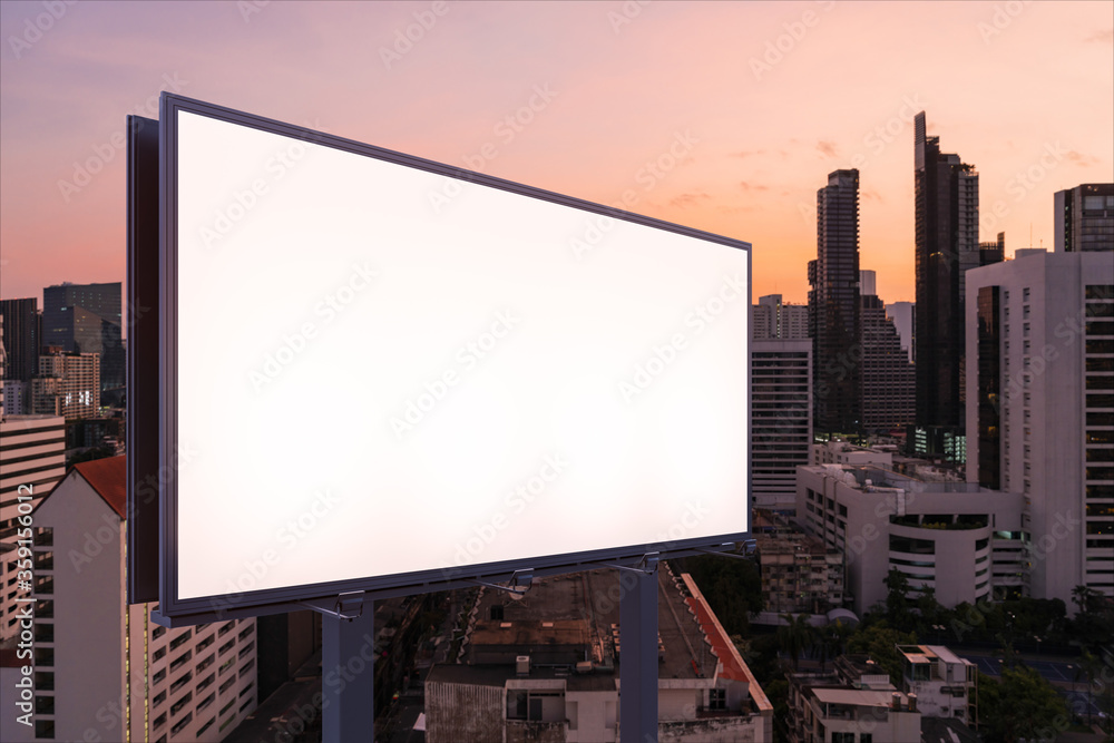 Blank white road billboard with Bangkok cityscape background at night time. Street advertising poster, mock up, 3D rendering. Side view. The concept of marketing communication to sell idea. Blank white road billboard with Bangkok cityscape background at night time. Street advertising poster, mock up, 3D rendering. Side view. The concept of marketing communication to sell idea.