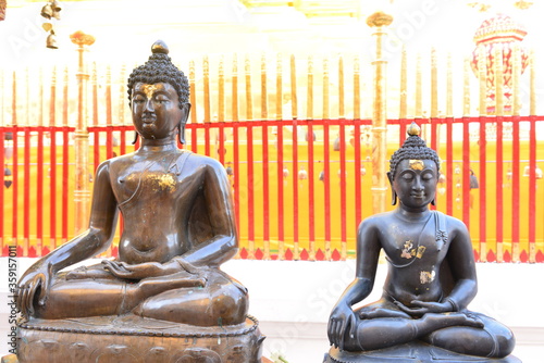Buddha statue around the golden pagoda at Wat Prathat Doi Suthep. Chiang Mai  Thailand.
