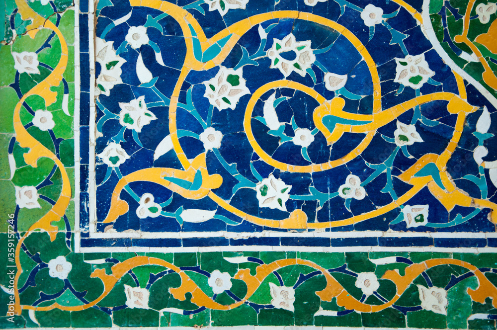 Beautiful Islamic patterns of Uzbekistan, Geometric and floral background, blue ceramic tiles on the wall of the mosque