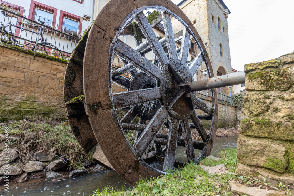 Water wheel in winter with icicles in Meisenheim Water wheel in winter with icicles in Meisenheim