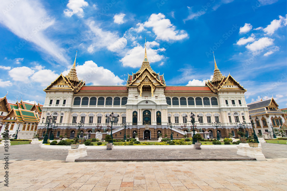 Chakri Maha Prasat building in The Grand Palace Bangkok Thailand on day with clear blue sky.