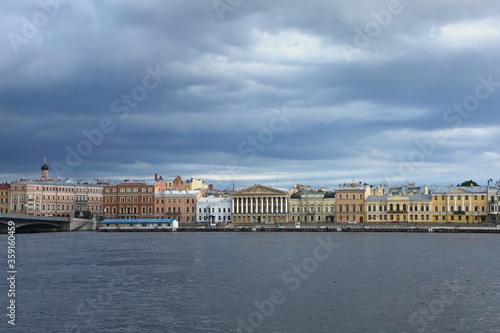 View accross the Neva river, which is one of the main waterways of the city, and historic colurful buildings on the other side, St Petersburg, Russia. © lisastrachan