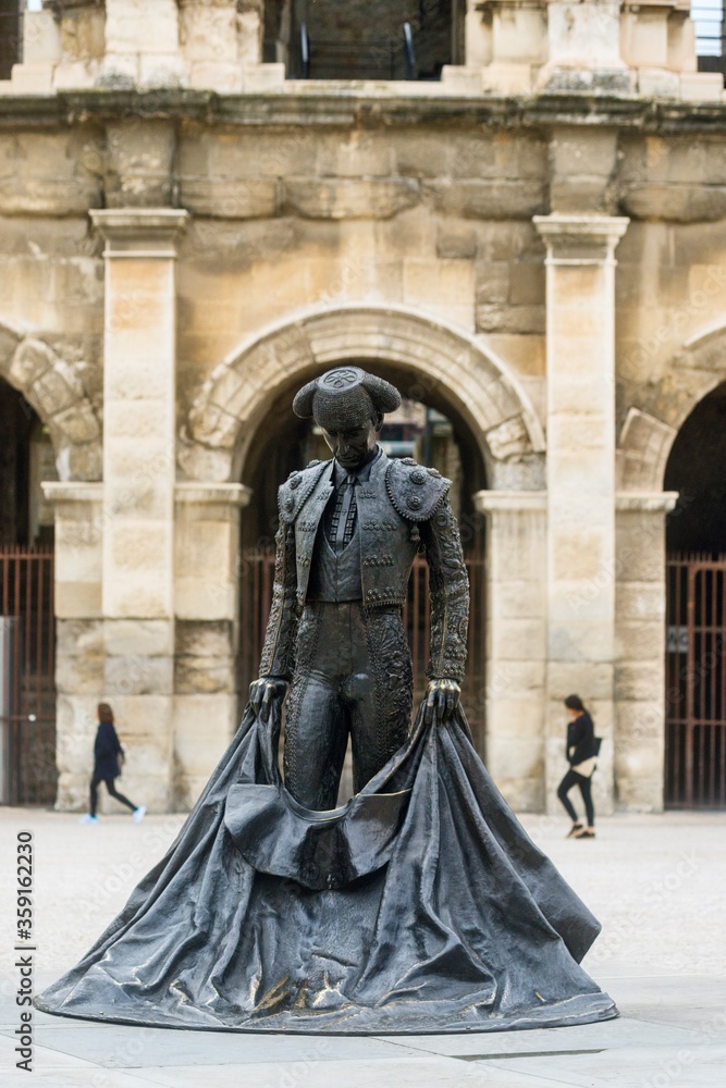 bronze sculpture of Nimeno II a bullfighter in front of the Arena in Nimes, France