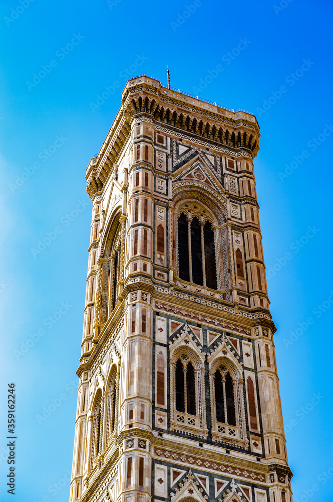 It's Giotto’s Campanile, a free-standing campanile, part of the complex of buildings that make up Florence Cathedral on the Piazza del Duomo in Florence, Italy.