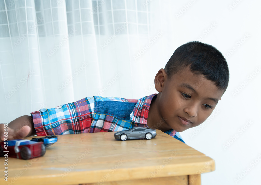 Cute little asian boy play toy car at room Cute little asian boy play toy car at room