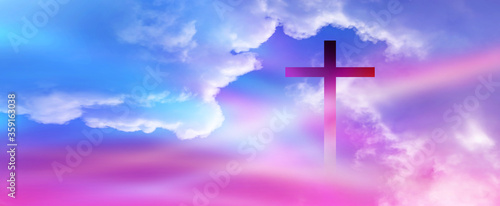 Christian cross appeared bright in the sky with soft fluffy clouds, white, beautiful colors. With the light shining as hope, love and freedom in the sky background © Ping198