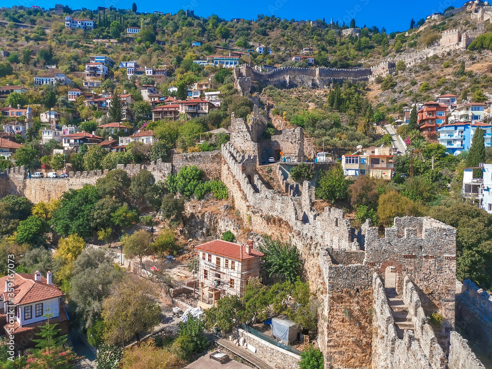 View on houses and Old fortress wall in Alanya with tower
