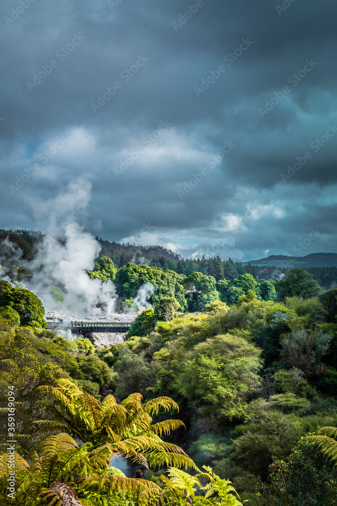 Fototapeta premium Dramatic winter sky over geothermal zone in mountains near Rotorua