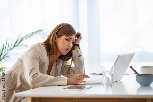 Fatigued businesswoman tired of computer work, exhausted employee suffering from blurry vision symptoms after long laptop use, overworked woman feels eye strain tension problem