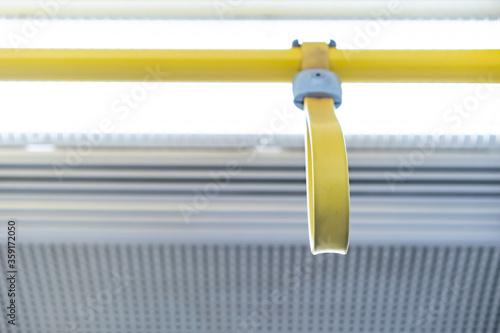 Close up the rubber - plastic cable hand holding in ariport rail link train. photo