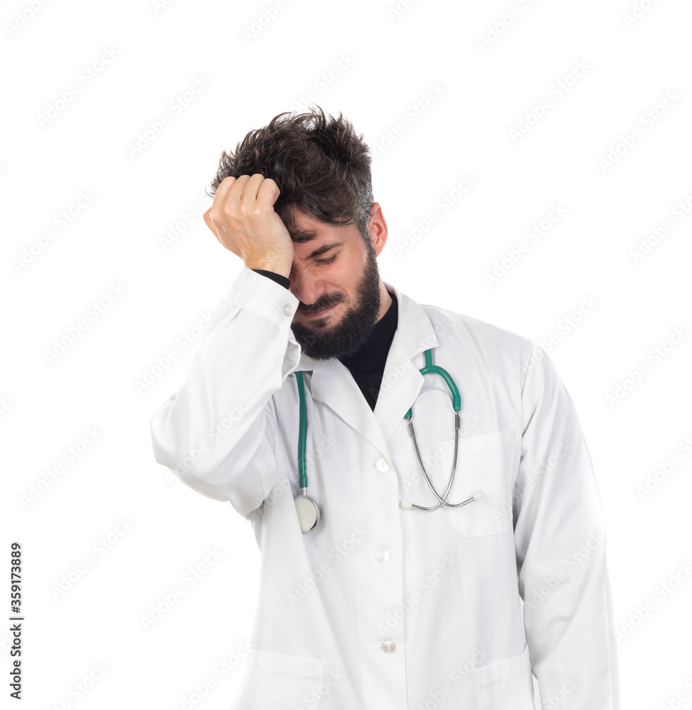 Young doctor with beard wearing a medical gown Young doctor with beard wearing a medical gown
