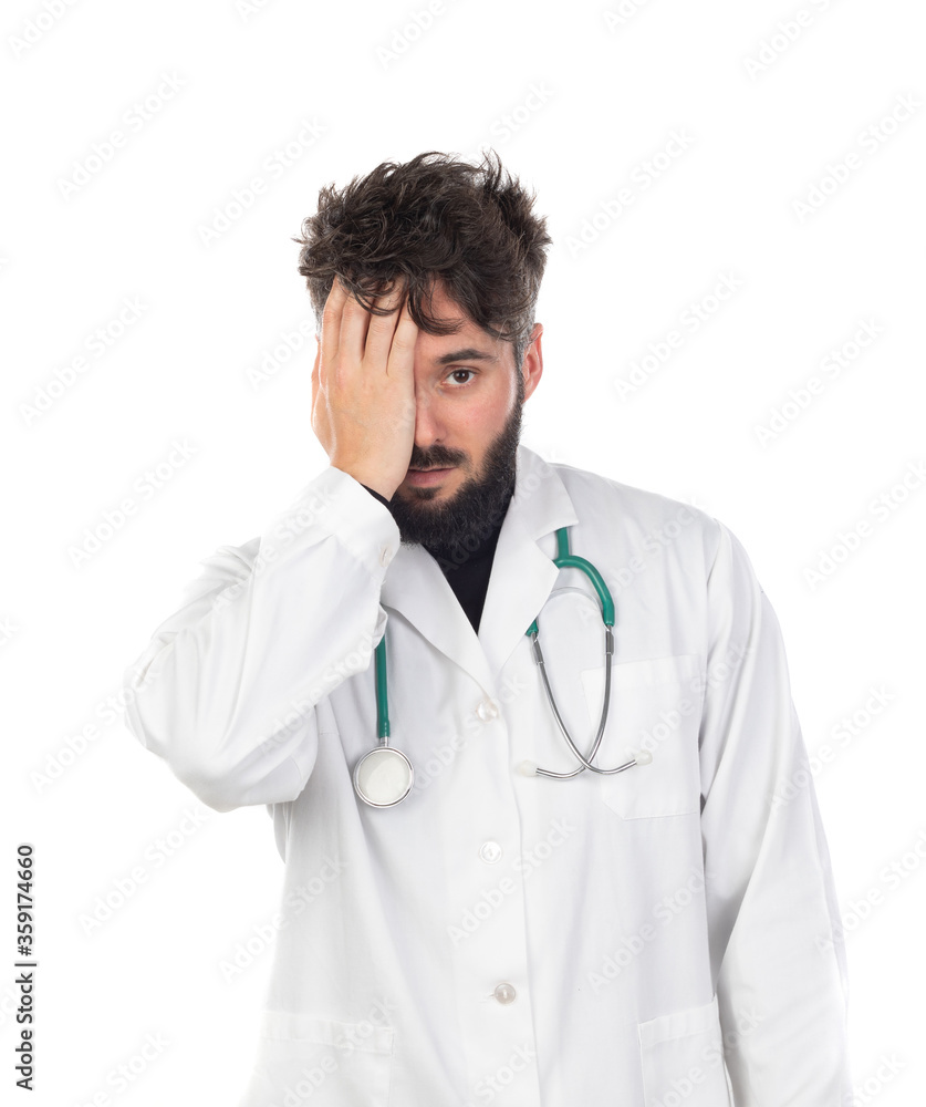 Young doctor with beard wearing a medical gown Young doctor with beard wearing a medical gown