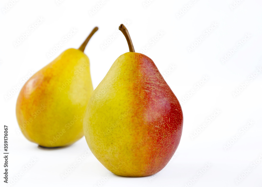 pear fruit, yellow fruits with red sides on a light background pear fruit, yellow fruits with red sides on a light background