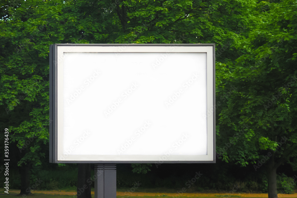 Fototapeta premium Billboard in the park, advertising space, template