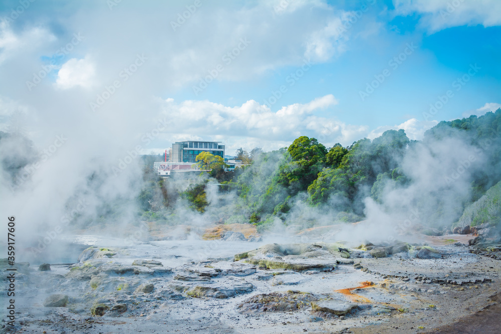 Fototapeta premium Steam rising above hot rocks in geothermal area near Rotorua