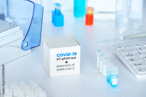 Quick novel COVID-19 coronavirus test kit. 2019 nCoV pcr diagnostics kit. Hand in glove with the box. The kit detects covid19 virus. Тest system for real-time quantitative PCR amplification.