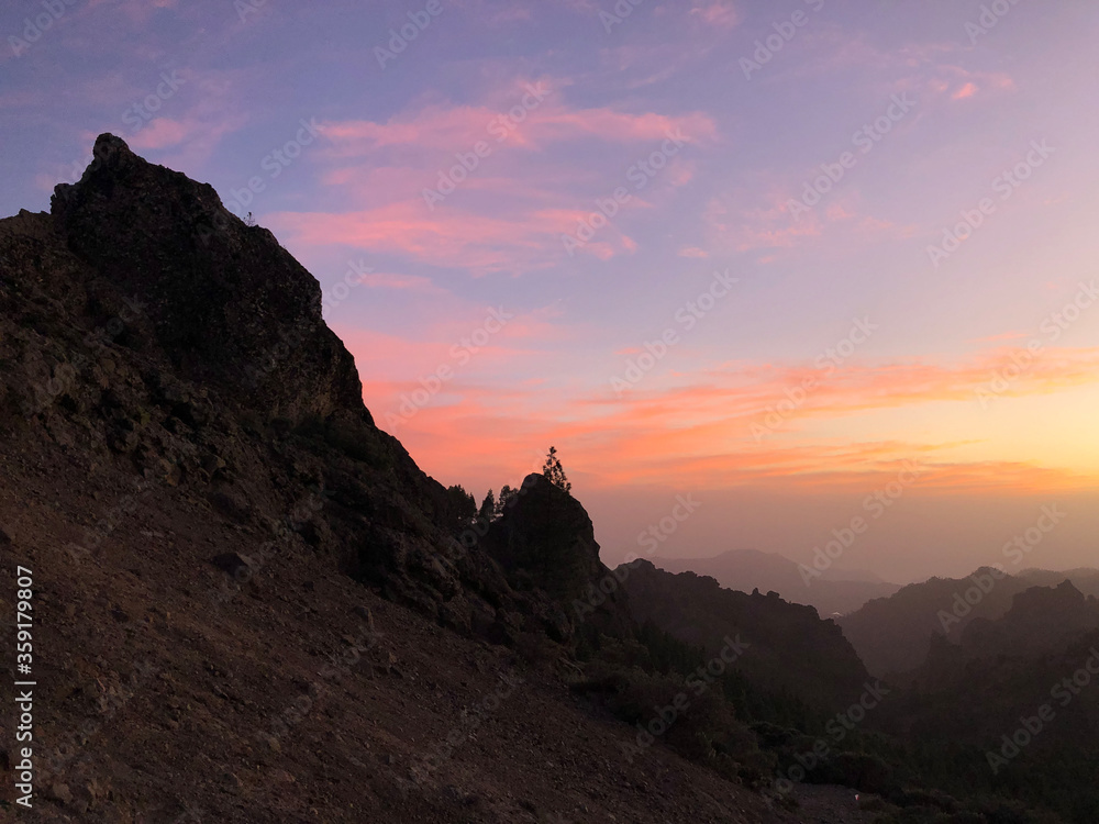 Sunset and pink sky at Roque Nublo the volcanic rock Sunset and pink sky at Roque Nublo the volcanic rock