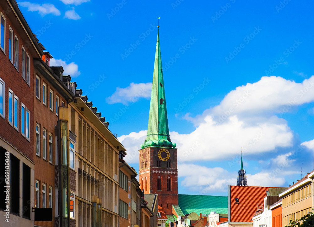 Lubeck, Germany, old city, downtown. Breite street, Evangelical church in the background