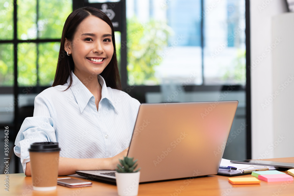 Business asian woman happy working job on laptop in office. Business asian woman happy working job on laptop in office.