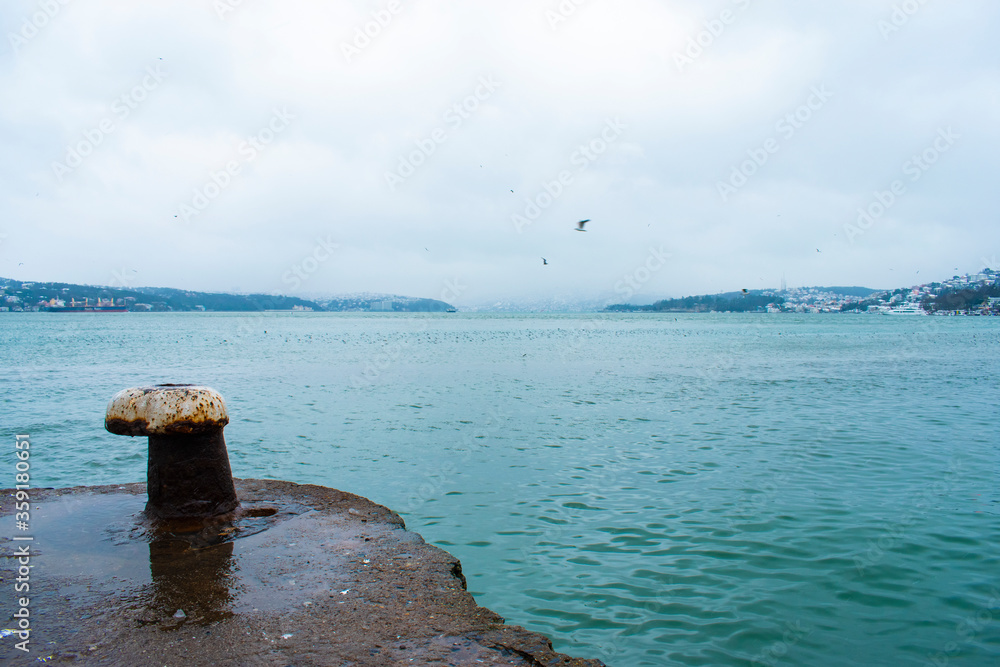 Bollard in foreground, seascape. Istanbul Bosphorus and bollard sea. Bollard in foreground, seascape. Istanbul Bosphorus and bollard sea.