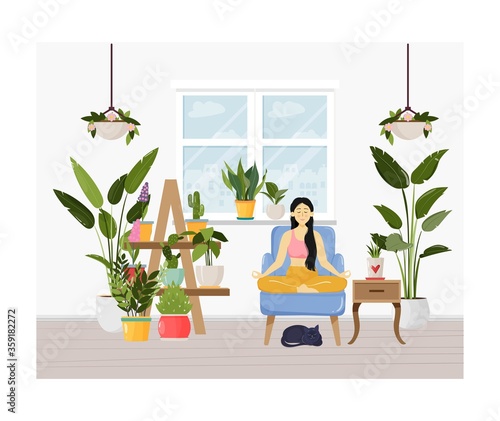 Young woman sitting in yoga lotus pose and meditating. Meditation practice at home with cute cat. Vector illustration. Urban jungle concept, room full of green potted plants