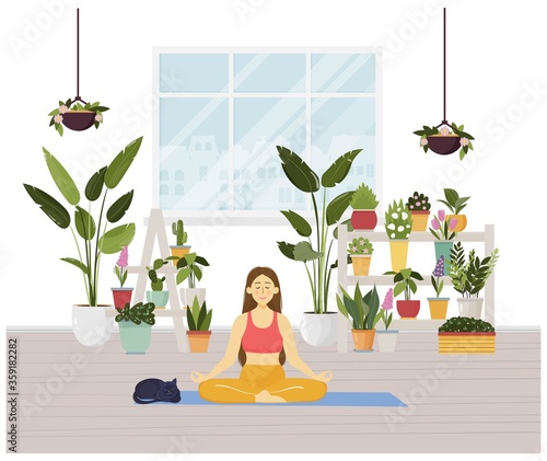 Young woman sitting in yoga lotus pose and meditating. Meditation practice at home with cute cat. Vector illustration. Urban jungle concept, room full of green potted plants