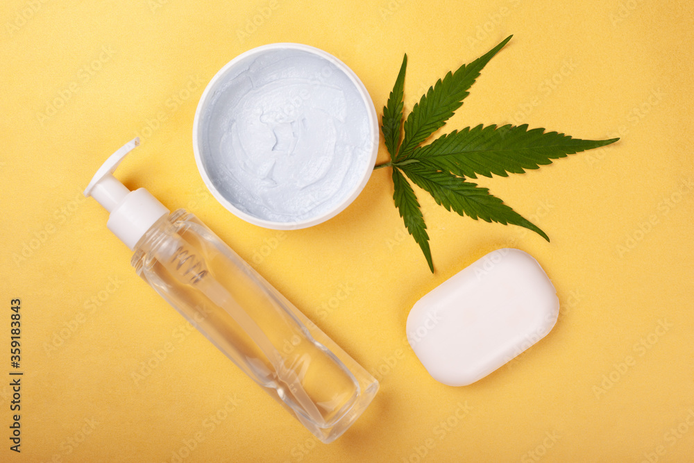 body care, cannabis cosmetics on a yellow background. body care, cannabis cosmetics on a yellow background.