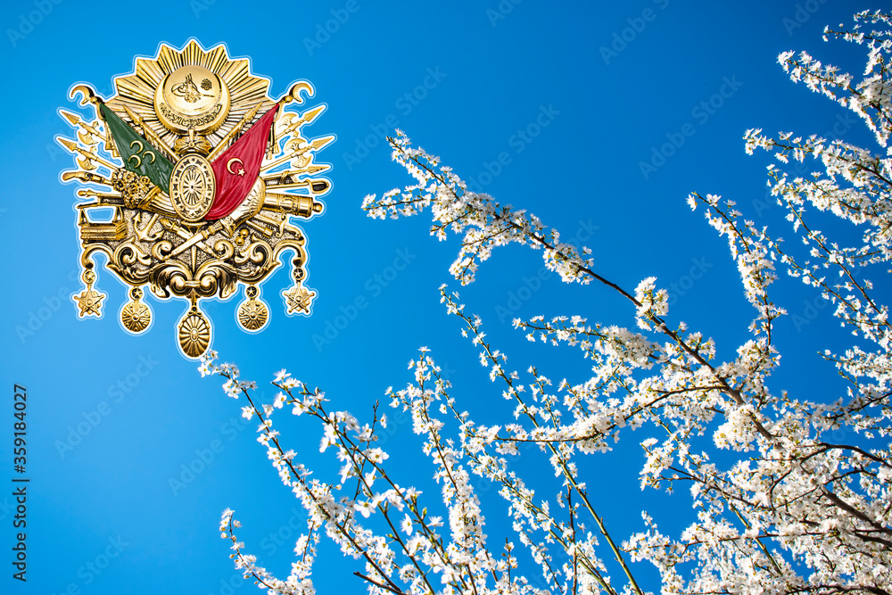 white flowers in the clear sky and the emblem of the Ottoman Empire ...