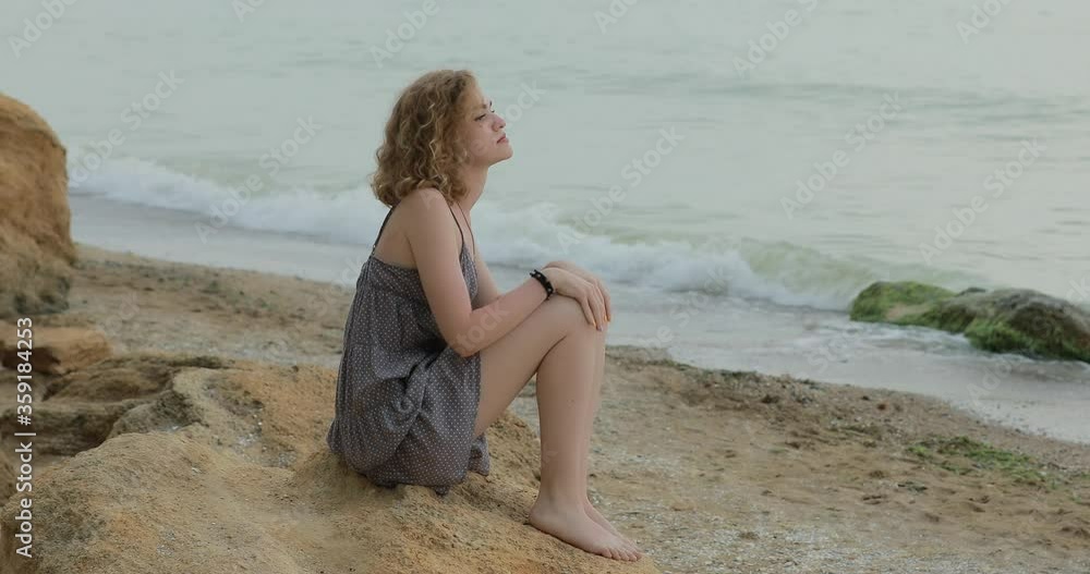Mosquito bites a woman while she sitting on sea beach Mosquito bites a woman while she sitting on sea beach