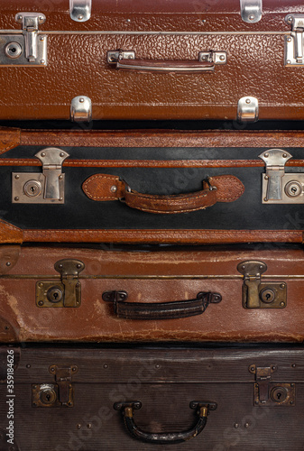 Old brown suitcases close up