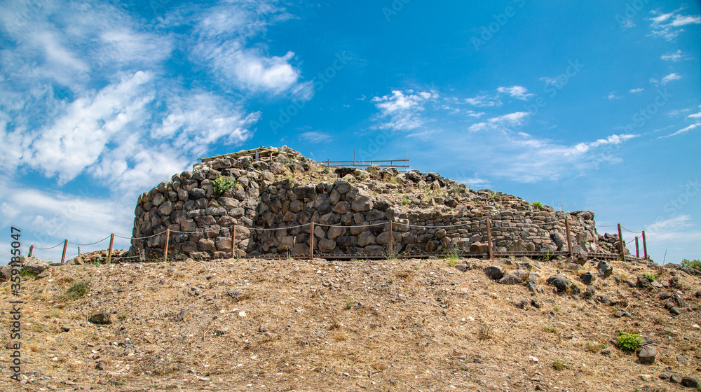 A nuraghe, an ancient megalithic edifice, in the nuragic sanctuary of Santa Cristina, near Oristano, Sardinia, Italy