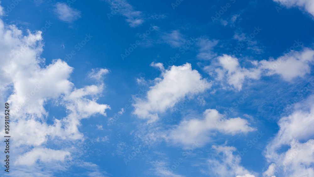 Fototapeta premium Blue sky with cloud background.White fluffy clouds in sunny day.