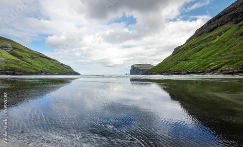 Obraz na plátně Reflection of the sky in the water in small bay of Tjornuvik, Faroe Island