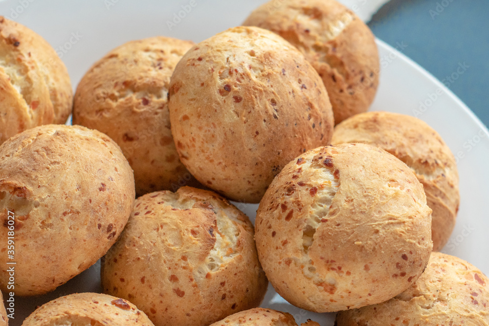 Fresh homemade cakes. Sweet rolls with a golden brown crust on baking paper Fresh homemade cakes. Sweet rolls with a golden brown crust on baking paper