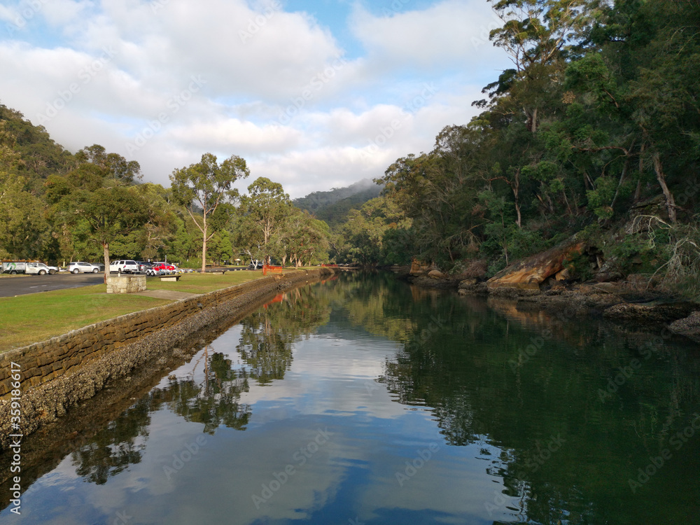 Fototapeta premium Early morning foggy view of Apple Tree creek, Bobbin Head, Ku-ring-gai Chase National Park, New South Wales, Australia