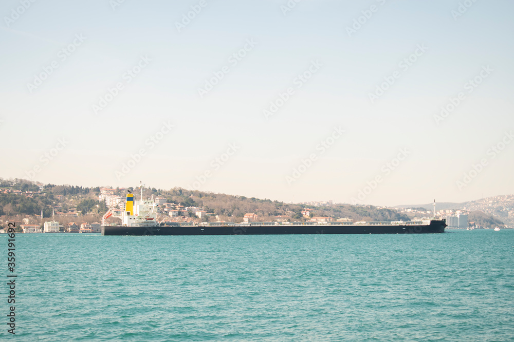 large cargo ship passing through the Bosphorus of Istanbul