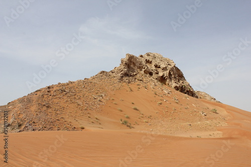 Hot and arid desert sand dunes terrain in Sharjah emirate in the United Arab Emirates. The oil-rich UAE receives less than 4 inches of rainfall a year and relies on water from desalination plants.