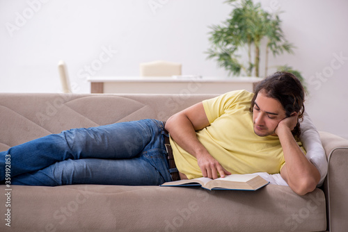 Young male student preparing for exams at home © Elnur