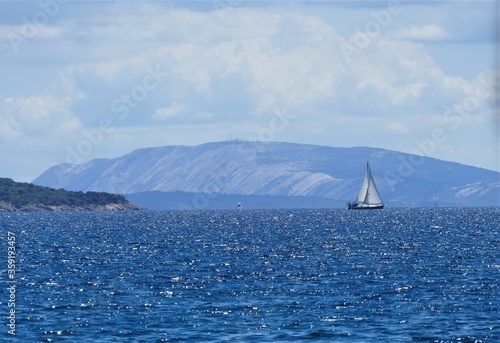 Beautiful sea horizon with big boat and island