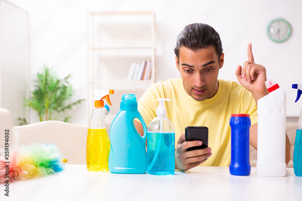Young male contractor doing housework at home Young male contractor doing housework at home