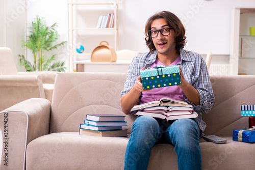 Young male student preparing for exams during Christmas