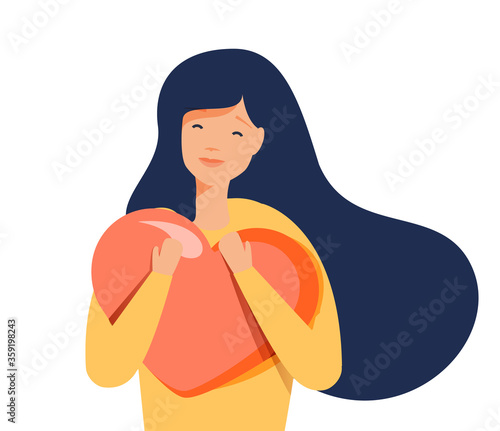 Young woman hugs a big heart with love and care. Girl with long hair holds pink heart in her hands. Self care, body care