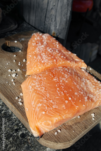 Salted salmon on a wooden chopping board