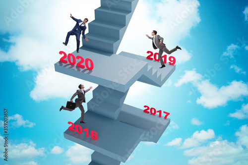 Businessman climbing stairs on yearly basis