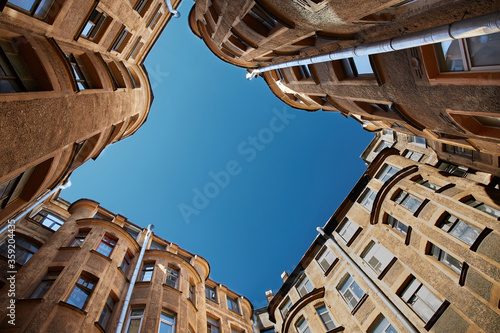 Looking up at the sky between buildings