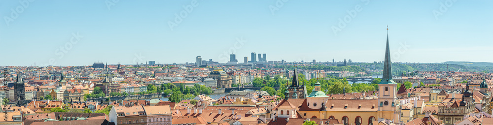 Panoramic view over beautiful old town with Charles Bridge Tower Gateway through river Vltava and new business district with skyscrapers in Prague, Czech Republic
