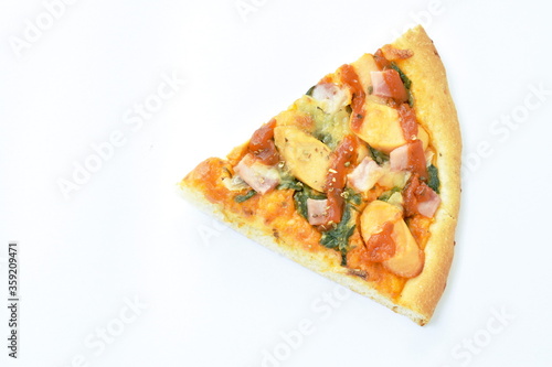 piece of Hawaiian pizza topping sausage and cheese on white background