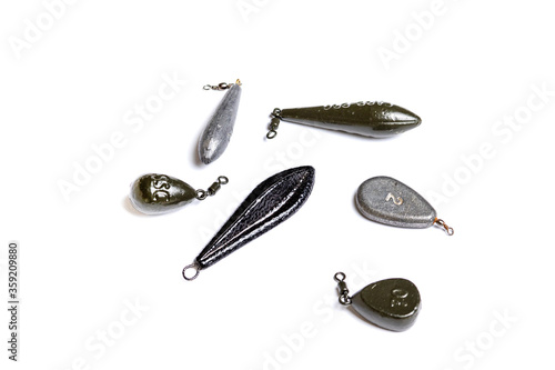 The set of lead fishing sinkers isolated on the white background.