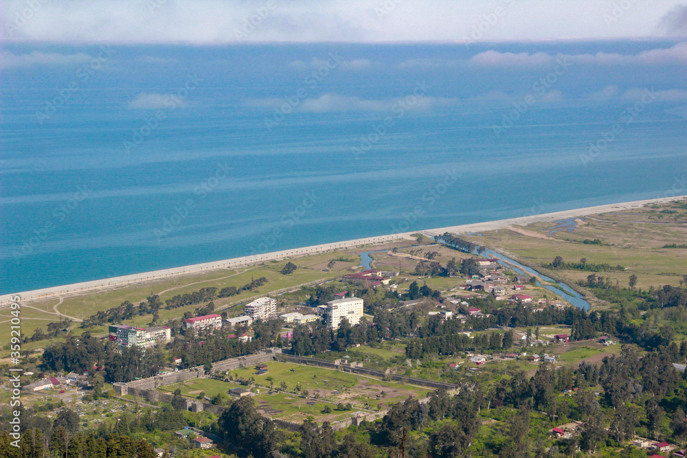 View of Gonio Apsaros Fortress, Black Sea beach and surrounding apartment buildings. Georgia, Gonio
