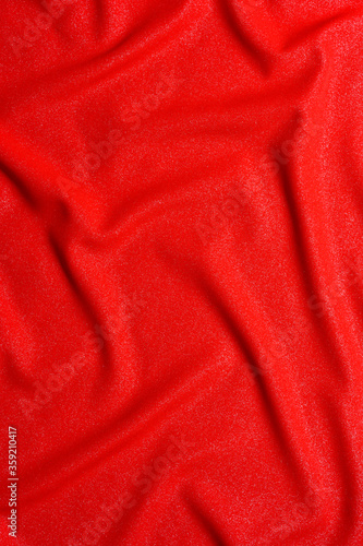 Texture of luxurious red silk fabric. Layout of a flag for training during design work on a colorful background.